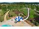 Community pool with water slide and surrounding landscaping at 243 Yorkshire Ln, Villa Rica, GA 30180