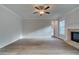 Spacious living room featuring hardwood floors, fireplace, and ceiling fan at 4045 Andover Cir, Mcdonough, GA 30252