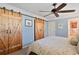 Serene bedroom with ceiling fan and rustic barn doors at 3429 Clubland Dr, Marietta, GA 30068