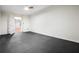 Finished basement room with gray rubber flooring and access to another room at 204 Gold Valley Xing, Canton, GA 30114