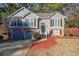 Lovely home with attached garage, complemented by a well-kept yard and attractive landscaping at 242 Viola Dr, Dallas, GA 30157
