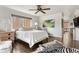 Spacious bedroom with hardwood floors, large window, and stylish decor at 190 Covered Bridge Sw Dr, Smyrna, GA 30082