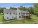 The home's backyard features a screened-in porch and raised deck at 289 Barn Rd, Canton, GA 30115