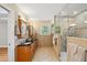 Stylish bathroom features double vanity with granite countertop, a large, tiled walk-in shower at 289 Barn Rd, Canton, GA 30115