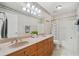 Bathroom boasts double sinks, a decorative mirror, and a shower and tub combination at 289 Barn Rd, Canton, GA 30115