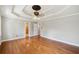 A bright bedroom is showcased with hardwood floors, neutral walls, and a unique ceiling at 289 Barn Rd, Canton, GA 30115