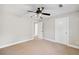 Bedroom featuring carpet, a ceiling fan, and access to a closet and a door at 289 Barn Rd, Canton, GA 30115