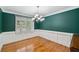 Dining room features wainscotting, hardwood floors and large window at 289 Barn Rd, Canton, GA 30115