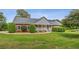 Charming single-story home with a brick facade, manicured lawn, and neatly trimmed hedges at 289 Barn Rd, Canton, GA 30115