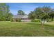 Well-maintained front yard with a covered front porch and manicured landscaping at 289 Barn Rd, Canton, GA 30115