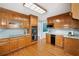 Updated kitchen with light wood cabinets, granite countertops, stainless steel appliances, and hardwood floors at 289 Barn Rd, Canton, GA 30115