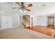 Open living area featuring hardwood flooring, carpet, ceiling fans and recessed lighting at 289 Barn Rd, Canton, GA 30115