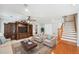 Cozy living room with custom built-ins, hardwood floors, and comfortable seating arrangement at 289 Barn Rd, Canton, GA 30115