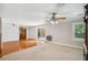 Expansive living space featuring hardwood flooring, carpet, sliding glass doors and ceiling fans at 289 Barn Rd, Canton, GA 30115