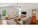 Bright living room featuring hardwood floors, neutral paint, and abundant natural light at 289 Barn Rd, Canton, GA 30115