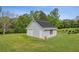 Exterior view of an outbuilding equipped with solar panels and garage door at 289 Barn Rd, Canton, GA 30115