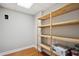 Spacious pantry with wooden shelving, providing ample storage for household items at 289 Barn Rd, Canton, GA 30115