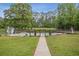 Backyard pool features a fenced perimeter, with a view of surrounding green trees at 289 Barn Rd, Canton, GA 30115