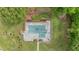 Aerial view of the pool with a diving board surrounded by a green lawn at 289 Barn Rd, Canton, GA 30115