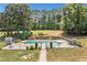 Fenced in backyard pool with mature landscaping, hardscaping, and privacy at 289 Barn Rd, Canton, GA 30115