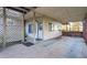 Covered back patio with concrete flooring, adjacent to a yard area, offering outdoor space at 1526 N Cherokee N Rd, Social Circle, GA 30025