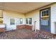 Covered back porch with a wooden deck, brick accents, and windows with natural light at 1526 N Cherokee N Rd, Social Circle, GA 30025