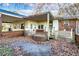 Backyard featuring a patio, brick accents, and the exterior of the house with covered porch at 1526 N Cherokee N Rd, Social Circle, GA 30025