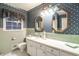 Charming bathroom featuring dual mirrors, light fixtures, and a neutral color palette at 1526 N Cherokee N Rd, Social Circle, GA 30025