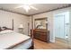 Inviting bedroom featuring a bed, dresser, nightstand, hardwood floors, and ceiling fan at 1526 N Cherokee N Rd, Social Circle, GA 30025