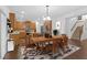 Open-concept kitchen and dining area with hardwood floors, stainless steel appliances, and ample space at 7601 Watson Cir, Locust Grove, GA 30248
