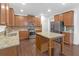 Well-equipped kitchen boasting granite countertops, stainless steel appliances, and a center island at 7601 Watson Cir, Locust Grove, GA 30248
