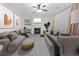 Comfortable living room features a cozy fireplace, built-in shelving, and neutral decor at 7601 Watson Cir, Locust Grove, GA 30248