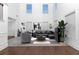 Bright living room featuring soaring ceilings, ample natural light, and modern decor at 7601 Watson Cir, Locust Grove, GA 30248