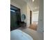 Bright bathroom featuring a soaking tub, walk-in shower, custom vanity, and an adjacent walk-in closet space at 2719 Winding Ne Ln, Brookhaven, GA 30319