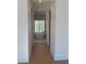 Elegant bathroom with a freestanding tub positioned beneath a window offering a view of the surrounding trees at 2719 Winding Ne Ln, Brookhaven, GA 30319