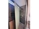 Modern bathroom featuring large-format marble tile walls, a brass rain shower head, and a built-in shelf at 2719 Winding Ne Ln, Brookhaven, GA 30319