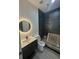 Stylish bathroom showcasing a modern vanity, sleek mirror, and a tiled shower area, blending design at 2719 Winding Ne Ln, Brookhaven, GA 30319