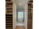 Luxurious bathroom showcasing a freestanding tub positioned between two expansive walk-in closets at 2719 Winding Ne Ln, Brookhaven, GA 30319