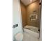 Modern bathroom with a glass-enclosed shower, vertical tiles, and sleek fixtures at 2719 Winding Ne Ln, Brookhaven, GA 30319