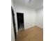 Bright bedroom features hardwood floors, fresh paint, and a glimpse into the en-suite bathroom at 2719 Winding Ne Ln, Brookhaven, GA 30319