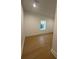 Bright bedroom featuring hardwood floors and natural light from the window at 2719 Winding Ne Ln, Brookhaven, GA 30319