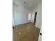 Light-filled bedroom featuring hardwood floors and a window with wooded views at 2719 Winding Ne Ln, Brookhaven, GA 30319