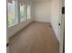 Bright bedroom with hardwood floors and large windows offering natural light at 2719 Winding Ne Ln, Brookhaven, GA 30319