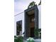 Close-up of a modern entryway with stone accents and minimalist landscaping at 2719 Winding Ne Ln, Brookhaven, GA 30319