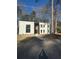 Modern home featuring a striking entryway and minimalist front yard at 2719 Winding Ne Ln, Brookhaven, GA 30319