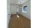 Bright hallway with hardwood floors and a stylish chandelier at 2719 Winding Ne Ln, Brookhaven, GA 30319