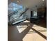 Open-concept interior with modern staircase, hardwood floors, and view of the kitchen at 2719 Winding Ne Ln, Brookhaven, GA 30319