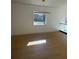 Spacious room featuring hardwood floors and natural light from a large window, perfect for versatile use at 2719 Winding Ne Ln, Brookhaven, GA 30319
