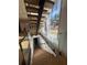 Open staircase design with wooden steps, glass railings, and large windows create a light-filled and modern look at 2719 Winding Ne Ln, Brookhaven, GA 30319