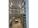 Spacious walk-in closet illuminated by recessed lighting, featuring custom shelving and ample storage options at 2719 Winding Ne Ln, Brookhaven, GA 30319